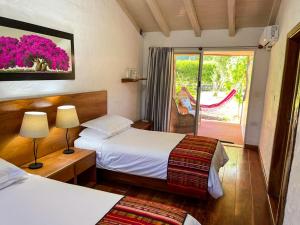 Voodi või voodid majutusasutuse Enchanted Galapagos Lodge toas