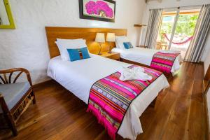 Voodi või voodid majutusasutuse Enchanted Galapagos Lodge toas