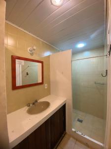 a bathroom with a sink and a shower at pousada vida de Búzios recanto in Búzios