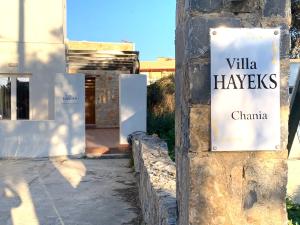 a sign on the side of a building that reads villa haves china at Hayeks Villa in Daratso