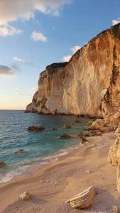 a view of a beach with a cliff at Anatoli House in Gaios