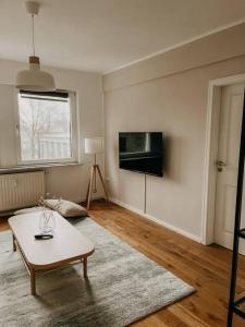 TV a/nebo společenská místnost v ubytování Zentrale 88qm mit Nähe zur Messe Essen! MA2L