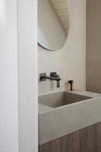 a bathroom with a sink and a mirror at Górski Domek Zakopane in Kościelisko +64 photos