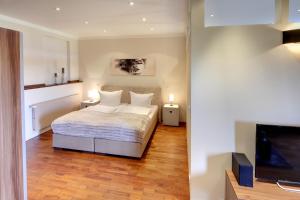 Een bed of bedden in een kamer bij Appartements Coloman