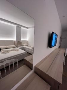 מיטה או מיטות בחדר ב-Best summer Apartment