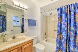 a bathroom with a toilet sink and a shower curtain at Less Than 1 Mi to Golf Home with Screened Porch in Sun City in Sun City West +17 photos