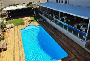 an overhead view of a building with a large swimming pool at Santorini Unit RR in Margate
