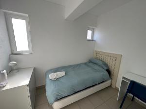 En eller flere senge i et værelse på Casa Sea Love Luz