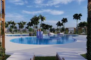 a large swimming pool with palm trees in the background at Delta Hotels by Marriott Dar es Salaam in Dar es Salaam