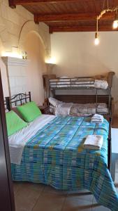 A bed or beds in a room at Masseria Cricelli