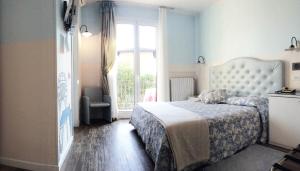 Posteľ alebo postele v izbe v ubytovaní Hotel Serenella