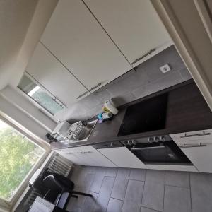 an overhead view of a kitchen with a tv at 3 Zimmer Standard Apartment - 7 Betten - 2 x Badezimmer in Wolfsburg