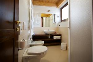 Baðherbergi á Hotel L' Aiglon