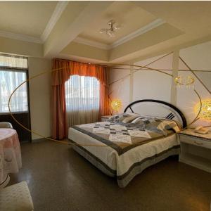 a bedroom with a bed with a yellow rope around it at Hotel Kokusai in Cochabamba