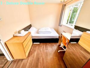 a small room with a bed and a desk at Central Palace - Excellent Stay in London Zone 1 in London