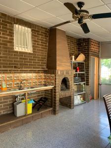 a kitchen with a brick wall with a brick oven at casa Salou individual in Salou