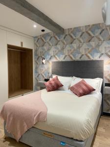 מיטה או מיטות בחדר ב-Siente Muralla