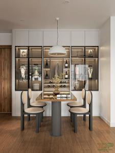 a dining room with a table and chairs and a display case at Chung cư Tecco Center Point Thanh Hóa in Thanh Hóa