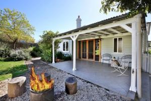 a backyard with a patio with a fire pit at Nowra Beauty in Nowra