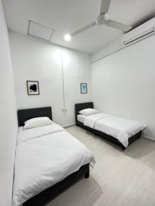 Cama o camas de una habitación en K.U Homestay