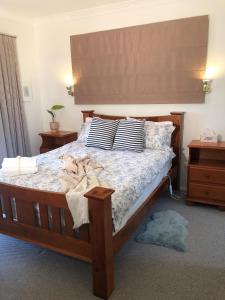a bedroom with a bed with pillows on it at Oaklands in Little Hartley
