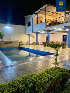 a house with a swimming pool at night at Casa Plaza Bolívar in Quillabamba