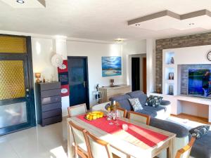 a living room with a table and a couch at Apartments Julijana in Makarska
