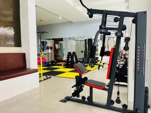 a gym with a treadmill and a treadmill at PJ Patong Resortel in Patong Beach