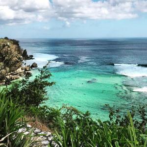 a view of a beach with turquoise water at The Room Padang-Padang in Uluwatu