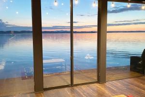 a view of the water from a room with windows at Tiny resort misawa in Misawa