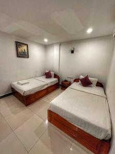 Tempat tidur dalam kamar di C55 Hotel Phnom Penh