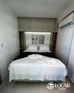 Flat 1203 BEIRA MAR no Barra Classic 객실 침대