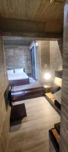 a bedroom with a bed and a tub in a room at Enishi Resort Villa in Huxi