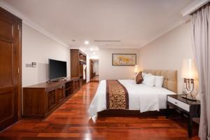 Postelja oz. postelje v sobi nastanitve Minh Toan Galaxy Hotel