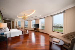 Postelja oz. postelje v sobi nastanitve Minh Toan Galaxy Hotel