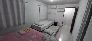 מיטה או מיטות בחדר ב-Village Pontes