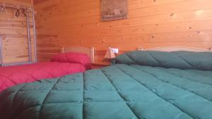 A bed or beds in a room at Casa Rural los Caños