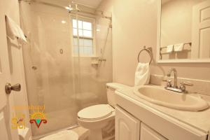 a bathroom with a toilet and a sink and a shower at Villa Del Sol in Ixmiquilpan +174 photos