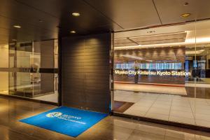 a lobby with a blue welcome mat in front of a door at Miyako City Kintetsu Kyoto Station in Kyoto