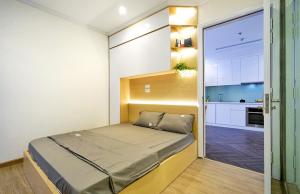 מיטה או מיטות בחדר ב-Times City Homestay