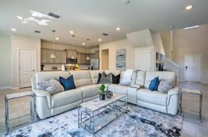 a living room with a couch and a table at NEW! Luxury Solterra Resort Home, Disney World Family Retreat Vacation in Davenport