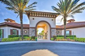 a house with palm trees in front of a driveway at NEW! Luxury Solterra Resort Home, Disney World Family Retreat Vacation in Davenport