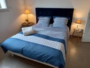 Posteľ alebo postele v izbe v ubytovaní Maison BELIZO, familiale ,calme et reposante.