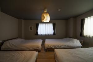 Ένα ή περισσότερα κρεβάτια σε δωμάτιο στο 自由自在OSU 202(UMI)