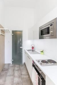 Η κουζίνα ή μικρή κουζίνα στο A59 Apartments