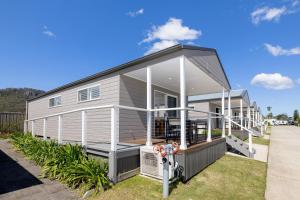 a modular home with a large front porch at BIG4 River Myall Holiday Resort in Bulahdelah