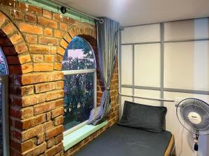 Istumisnurk majutusasutuses Rahees Bi Roambay - Backpacker Hostel