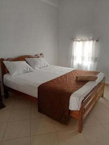 a large bed in a room with a window at House with backyard in dahab in Dahab