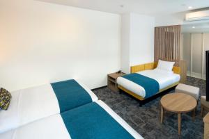 Postel nebo postele na pokoji v ubytování FLEXSTAY INN Shinurayasu + 17 fotografií