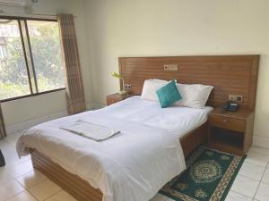 Ένα ή περισσότερα κρεβάτια σε δωμάτιο στο Hotel River View